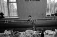 Рома смотрит на стол накрытый чтобы отпраздновать появление его и Леры в семейном детском доме Шполянских. Старая Богдановка, 2001